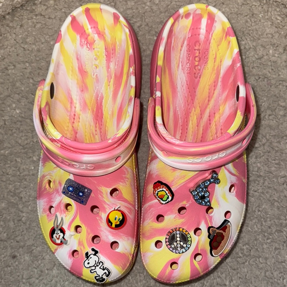 CROCS Pink and Yellow Sandals with Vibrant Tie-Dye Pattern